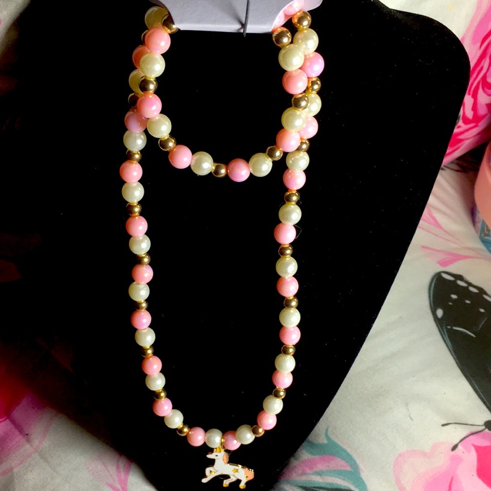 Girls pink pearl necklace and bracelets